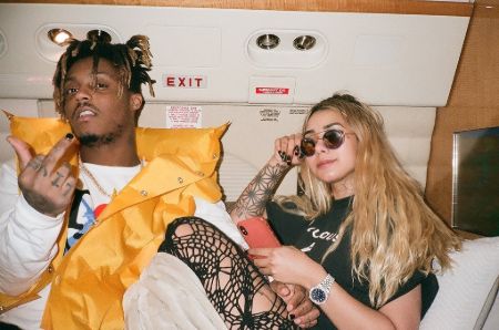 Juice Wrld with girlfriend Ally lotti on a jet, juice holding his middle finger up lotti posing with her diamond studded rolex 